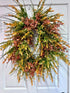 Oval pink/orange mixed greenery wreath